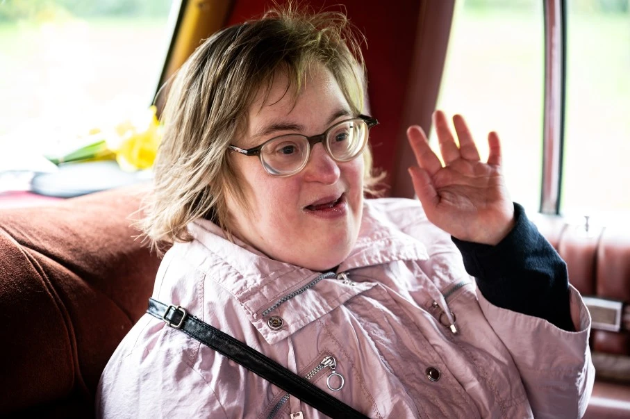 Disabled woman in the back of car